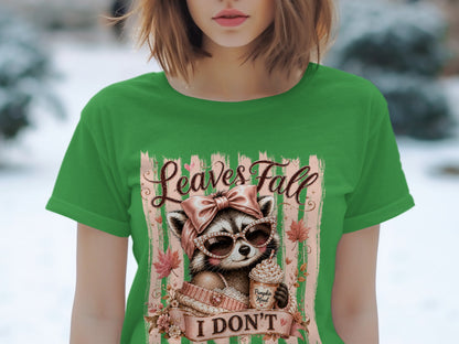 Green t-shirt with a raccoon wearing a bow and sunglasses, holding a pumpkin mood drink.