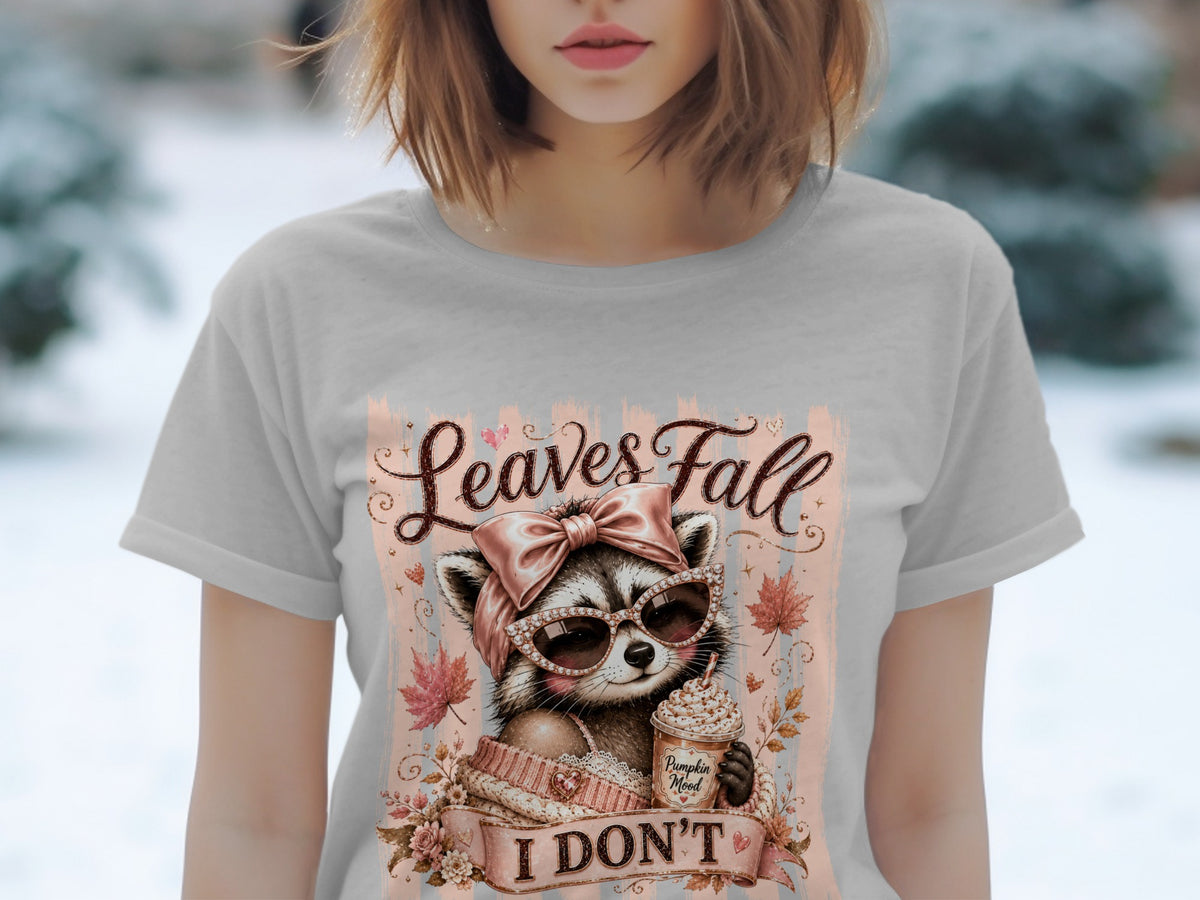 Raccoon in sunglasses holding pumpkin spice latte with "Leaves Fall I DON'T" text.