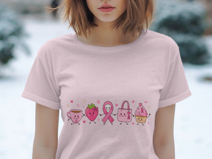 Pink t-shirt with cartoon coffee cup, strawberry, ribbon, handbag, and cupcake.