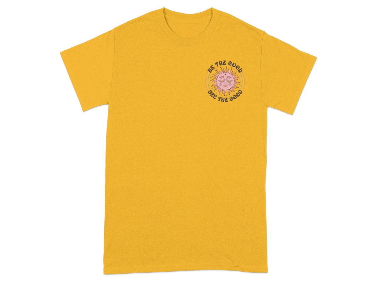 Yellow t-shirt with sun graphic and text "Be the Good See the Good".