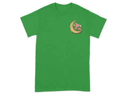 Green t-shirt with crescent moon, flowers, and text "TAKE A MOMENT TO BREATHE".