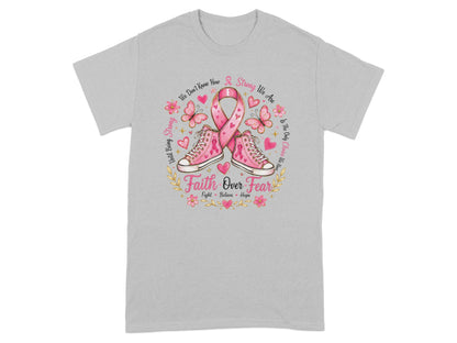 Pink sneakers, ribbon, butterflies, and "Faith Over Fear" text on a gray t-shirt.