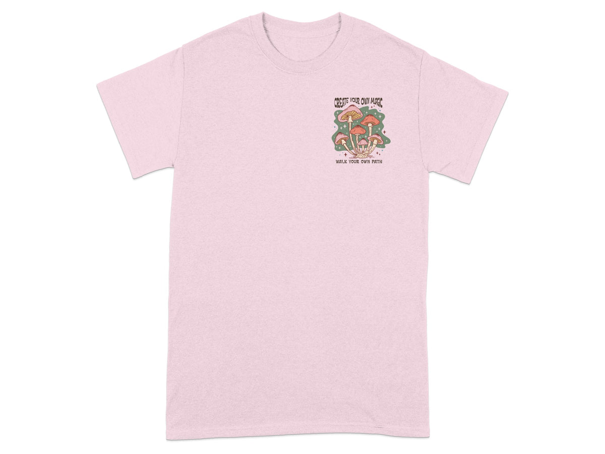 Pink t-shirt with a mushroom graphic and text "Create your own magic, walk your own path."