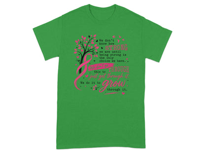 Green t-shirt with pink ribbon, tree, birds, and inspirational text.