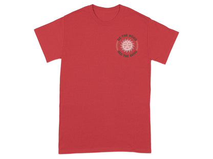 Red t-shirt with sun graphic and text "Be The Good See The Good".