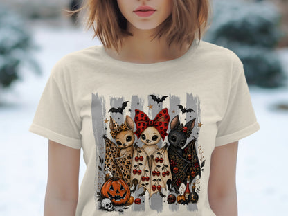 Three cartoon bats with Halloween motifs, including a pumpkin and skulls.