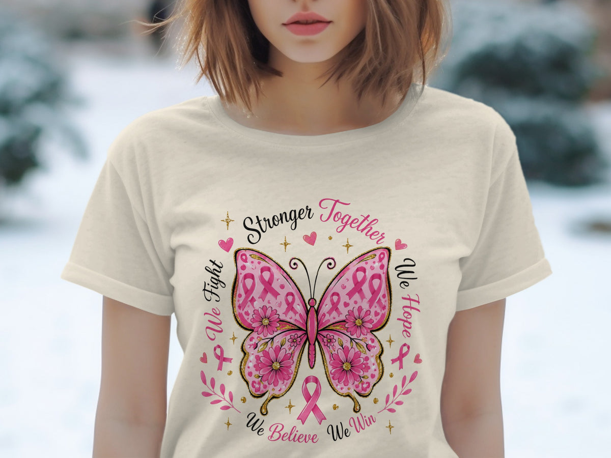 Cream t-shirt with a pink butterfly design and text "Stronger Together" and "We Fight, We Hope, We Believe We Win".