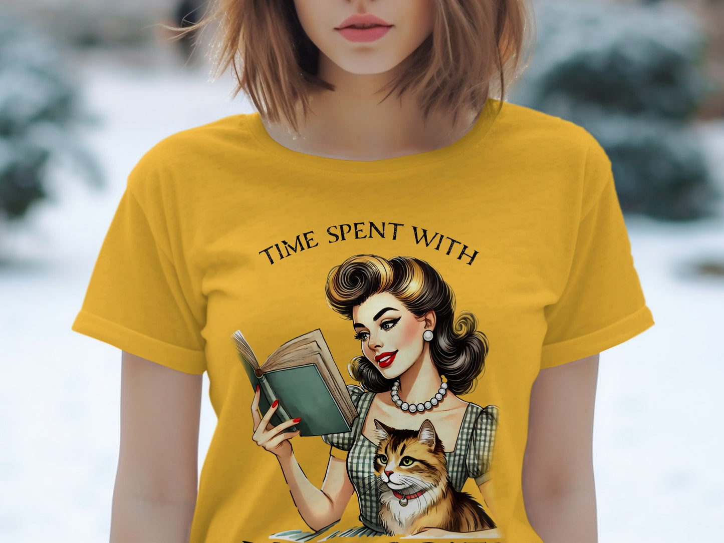 Yellow t-shirt with "Time Spent With" text, featuring a woman reading a book with a cat.