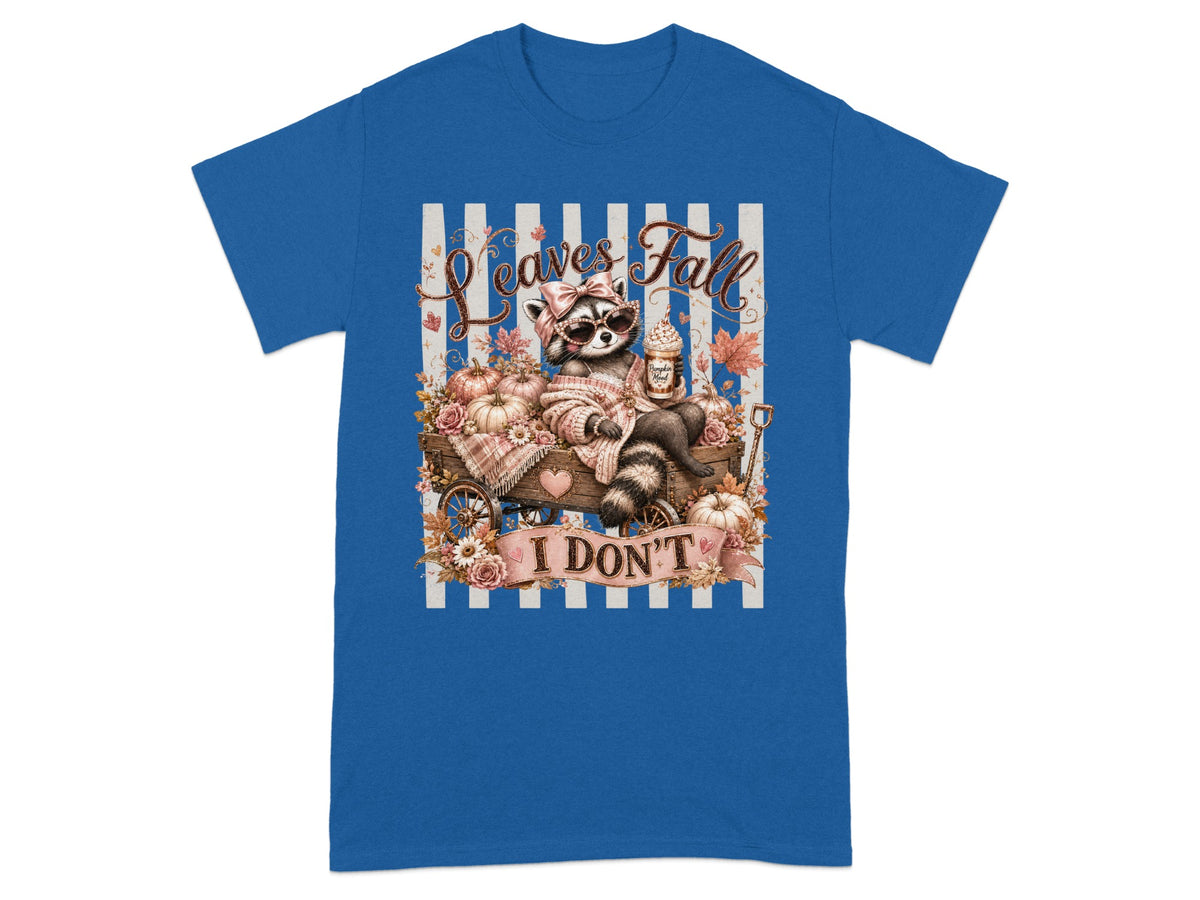 Raccoon in sunglasses sitting in a cart with pumpkins and "Leaves Fall I Don't" text.