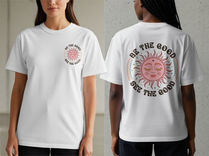 White t-shirt with a sun graphic and text "Be the Good See the Good".