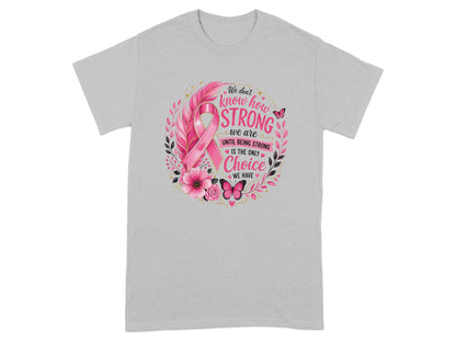 Gray t-shirt with pink ribbon, floral design, and text about strength.