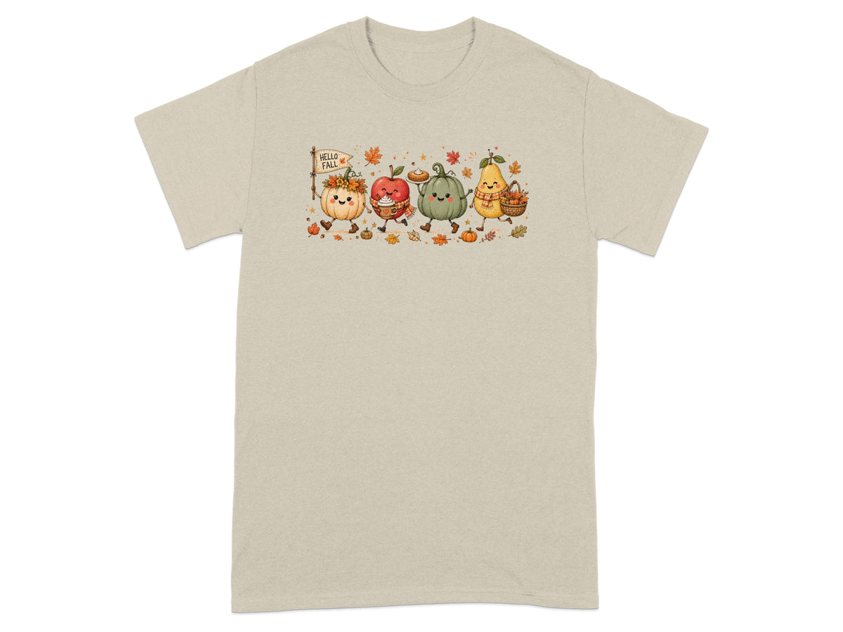 Animated fall characters including pumpkins, apple, and pear on a light tan t-shirt.