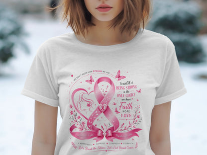 White t-shirt with pink breast cancer ribbon, butterflies, heart, and motivational text.