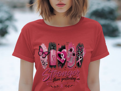 Red t-shirt with "Stronger than yesterday" text and breast cancer awareness symbols.