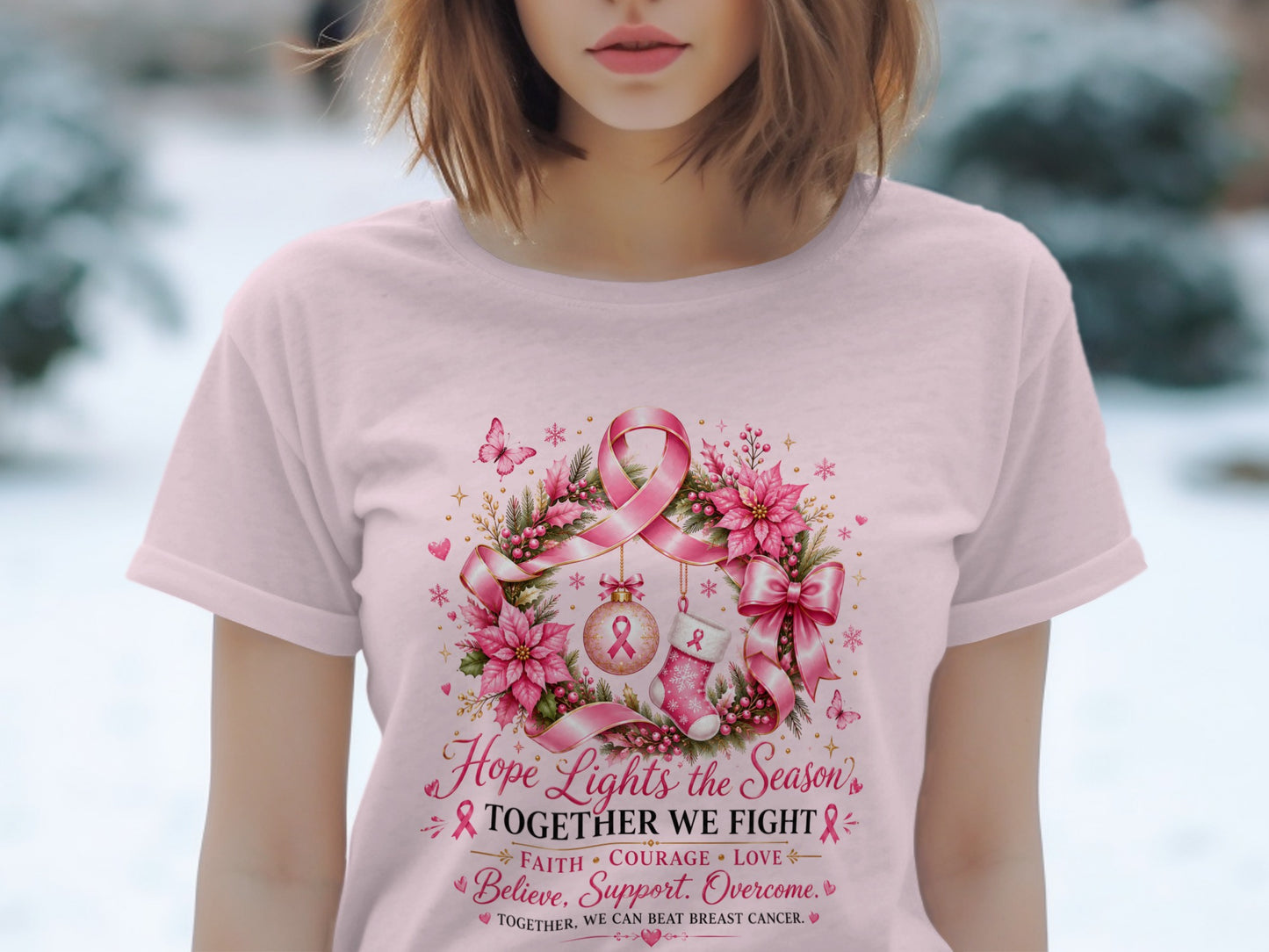 Pink t-shirt with wreath design featuring breast cancer ribbons, poinsettias, and text.