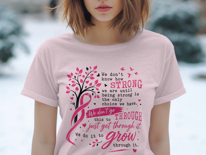 Pink t-shirt with text about strength, a pink ribbon, and a tree with pink leaves.