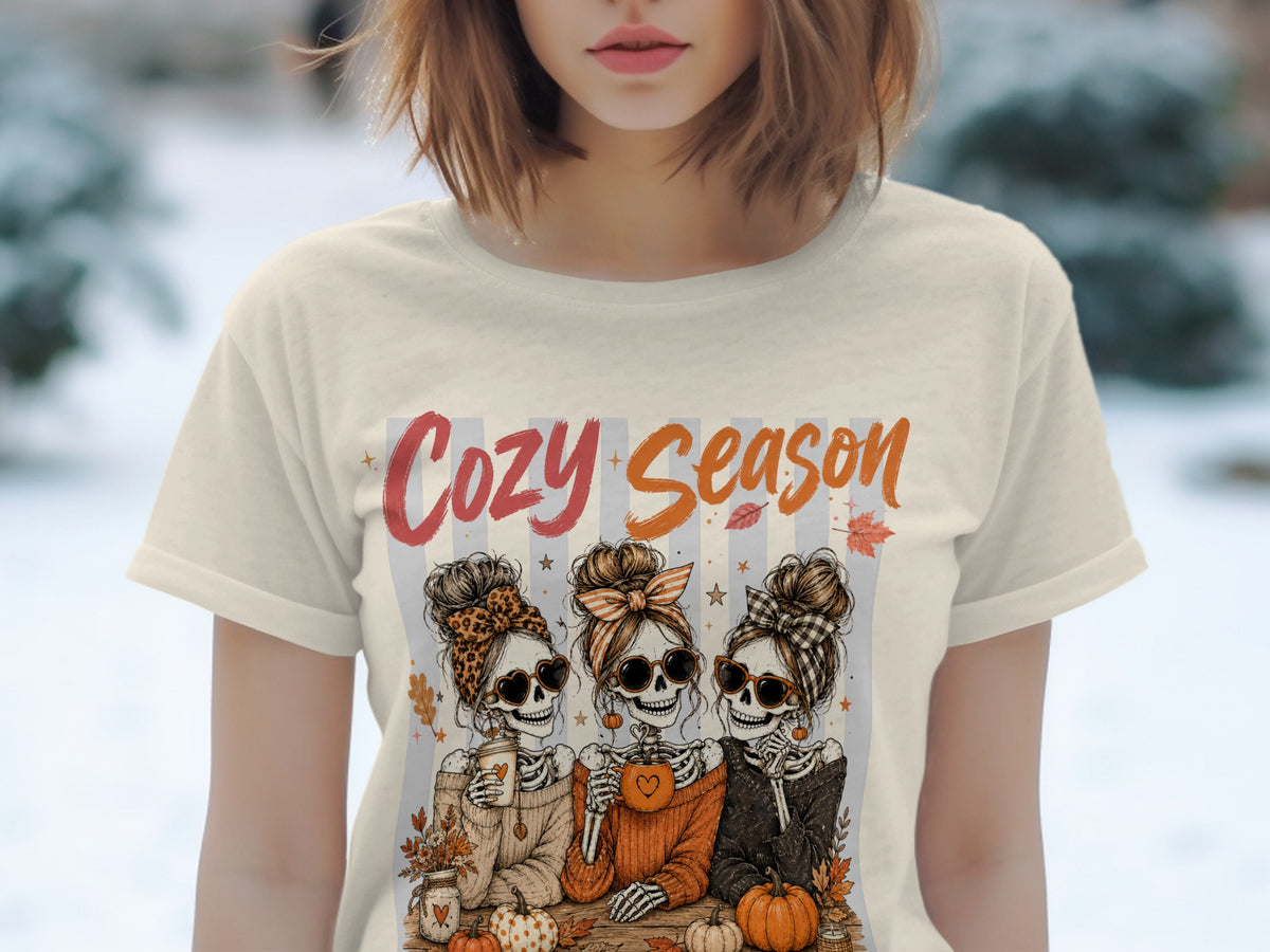 Skeleton friends with heart sunglasses and messy buns, "Cozy Season" text.