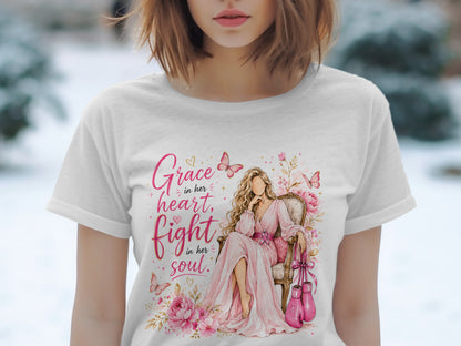 Woman in pink dress with boxing gloves and text "Grace in her heart, fight in her soul".