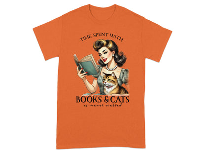 T-shirt with illustration of woman reading book with cat, text: "Time spent with books & cats is never wasted."