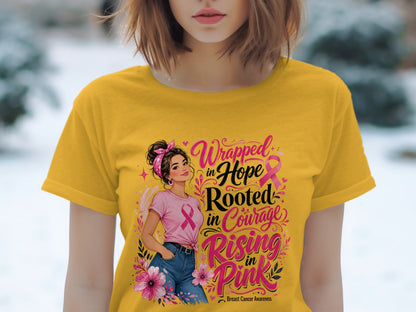 Yellow t-shirt with "Wrapped in Hope Rooted in Courage Rising in Pink" Breast Cancer Awareness graphic.