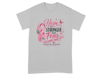 Gray t-shirt with pink ribbon and "Hope is Stronger Than Fear" breast cancer awareness graphic.