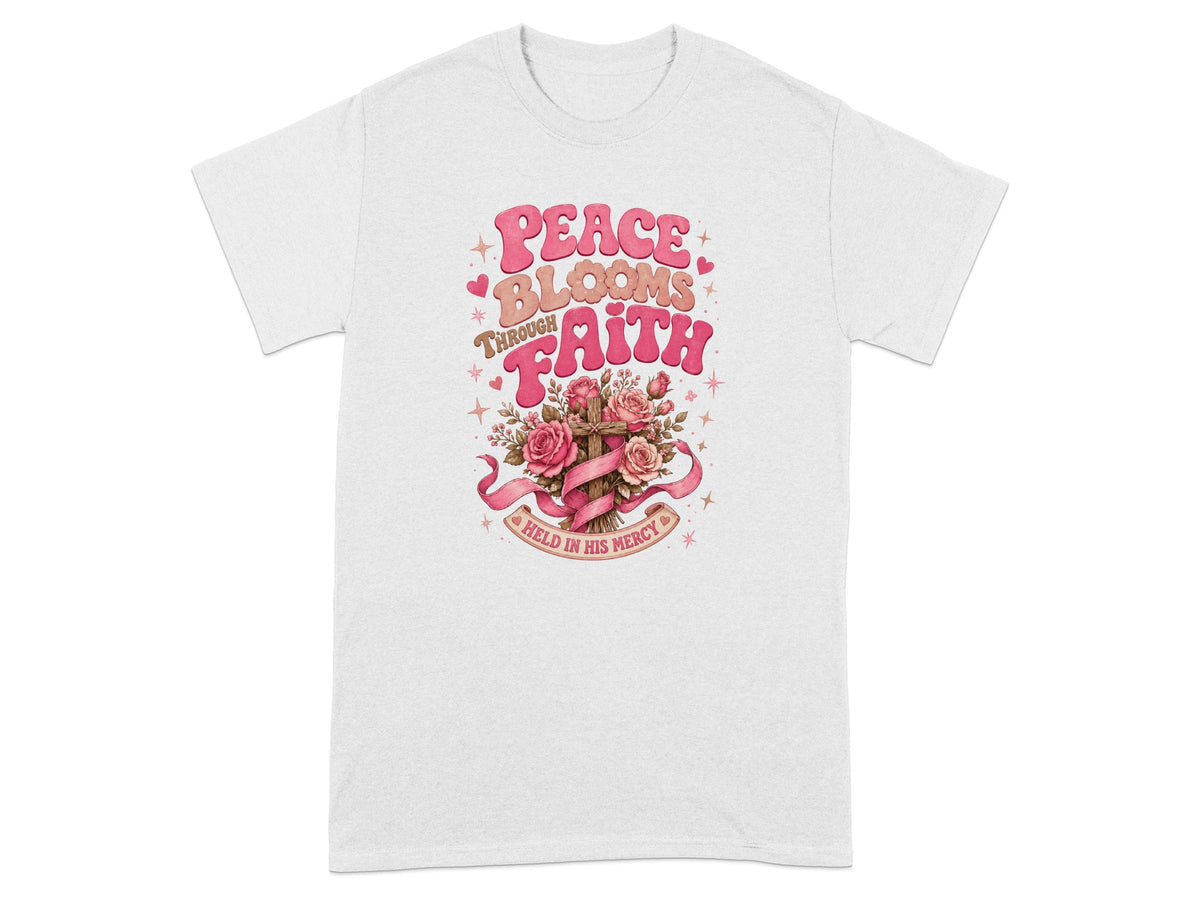 T-shirt with "Peace Blooms Through Faith Held in His Mercy" text and floral cross graphic.