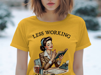 Yellow t-shirt with retro graphic of a woman reading, "Less Working" text.