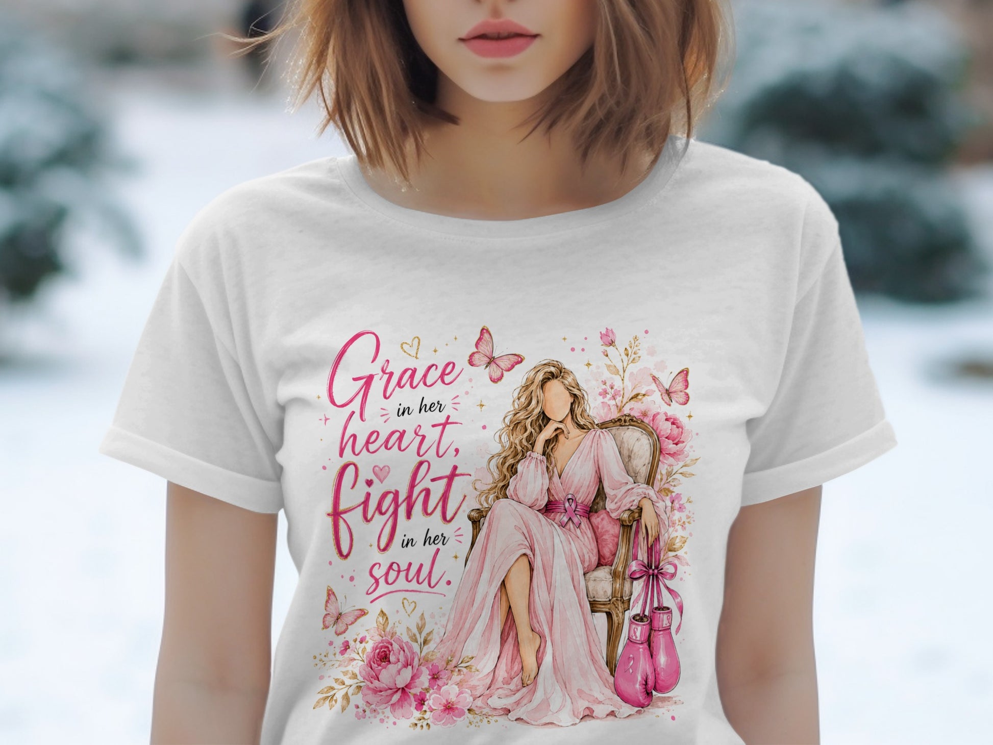 T-shirt with watercolor art of a woman sitting with boxing gloves and text "Grace in her heart, fight in her soul."
