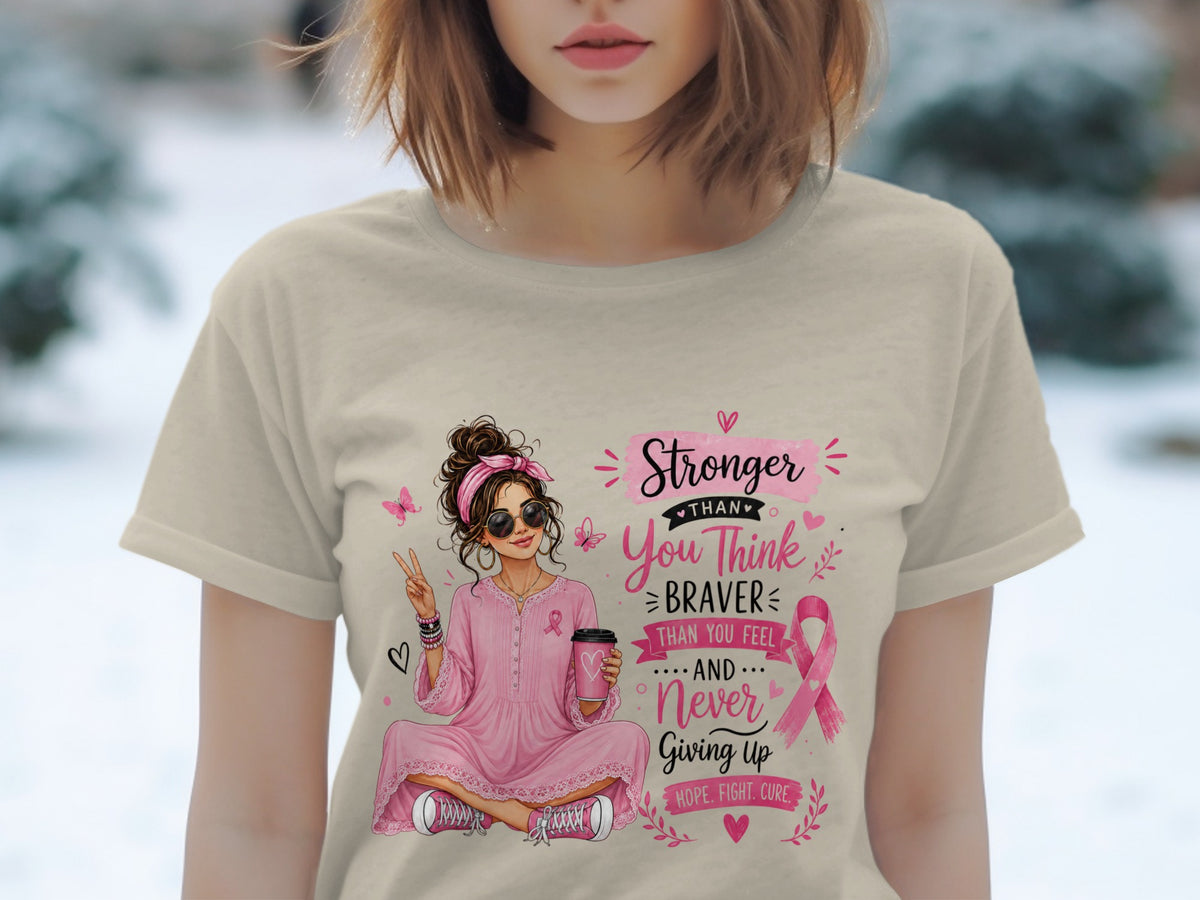 Illustration of woman with coffee cup, breast cancer ribbon, and text: Stronger than you think, braver than you feel, never giving up.