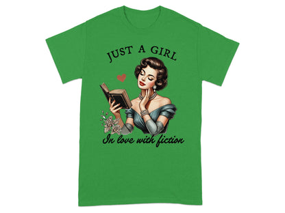Green t-shirt with woman reading book and text "JUST A GIRL in love with fiction".