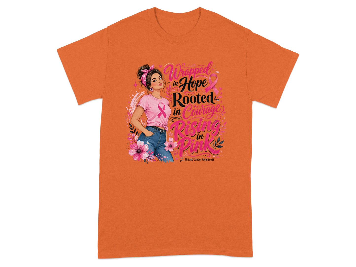 Orange t-shirt with graphic: "Wrapped in Hope Rooted in Courage Rising in Pink Breast Cancer Awareness".