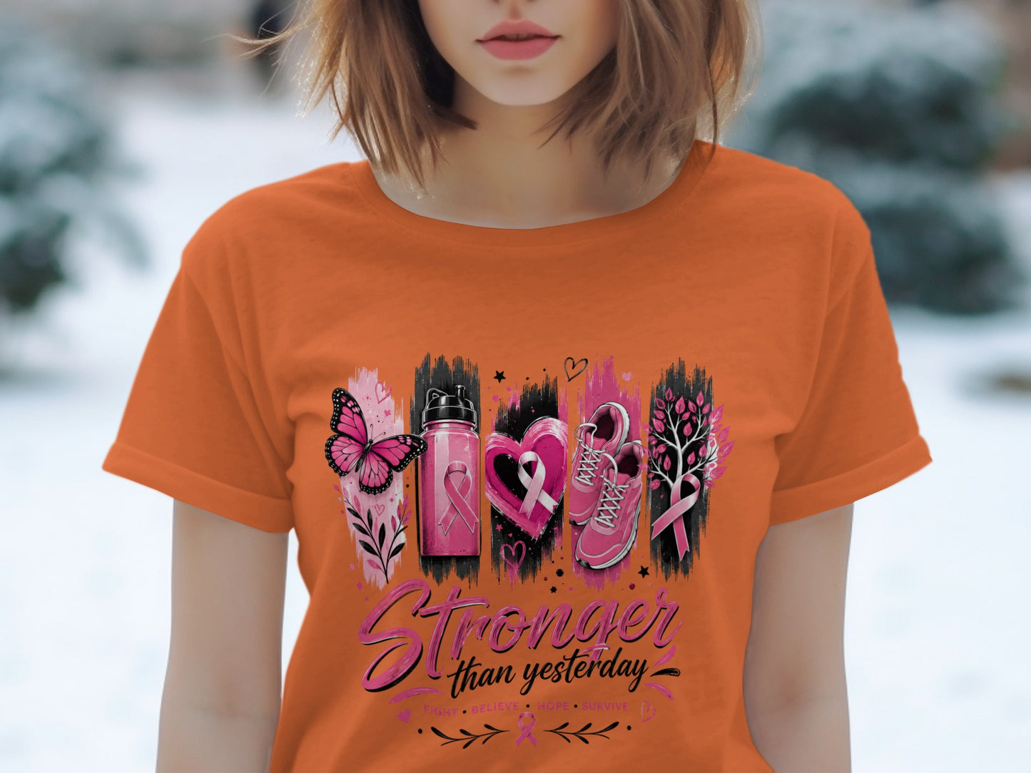 Orange t-shirt with pink butterfly, water bottle, heart, shoes, and tree graphics.