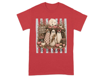 Three ghosts stand by a wagon filled with pumpkins, with text "Tis The Season" below.