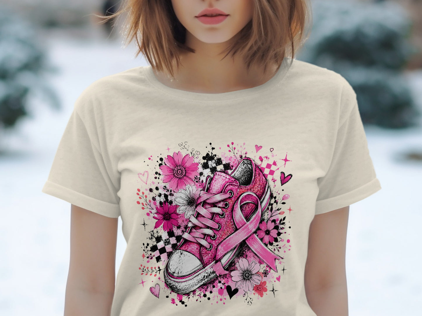 Pink sneaker with breast cancer ribbon surrounded by flowers and hearts.