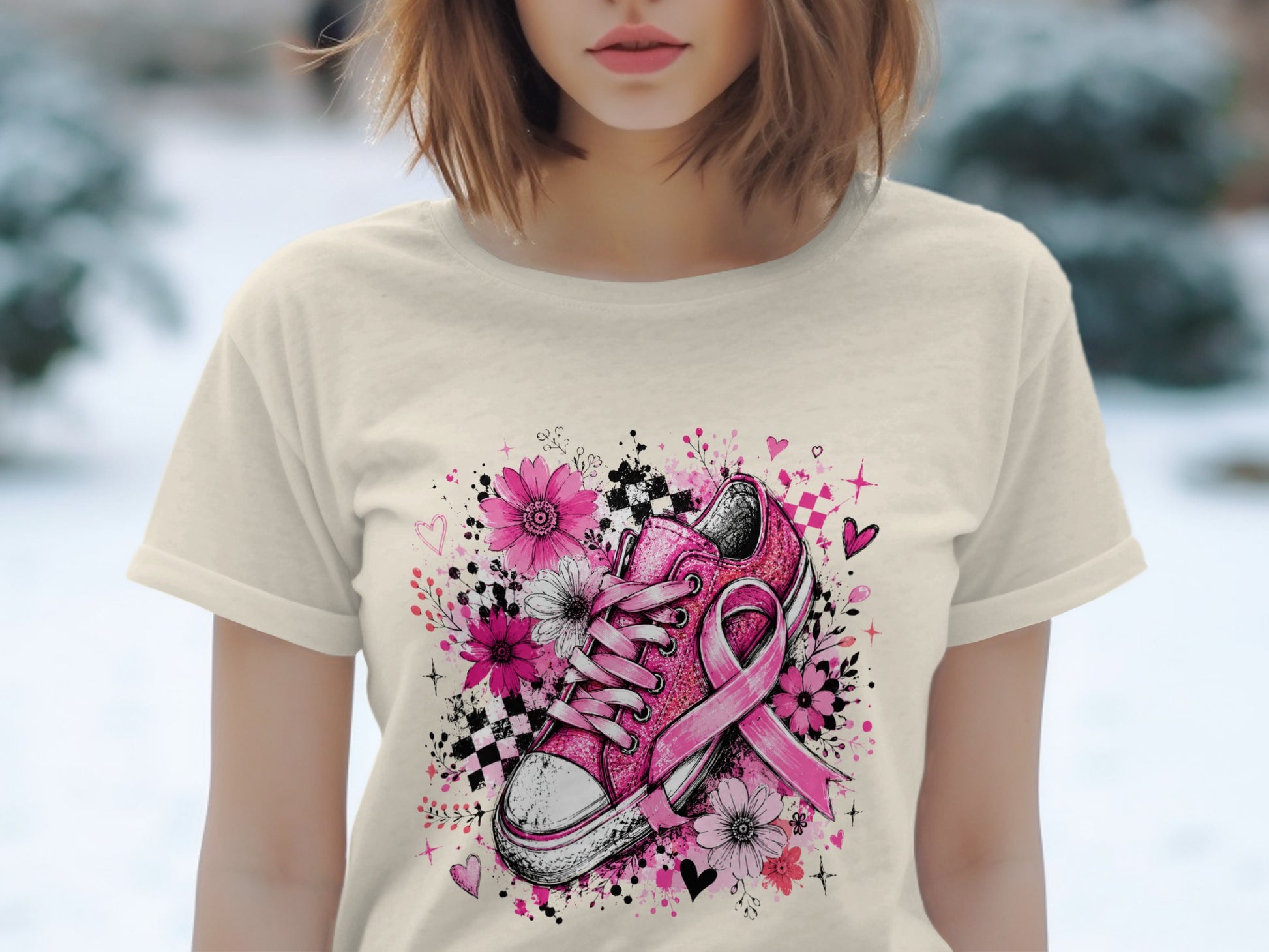 Pink sneaker with breast cancer ribbon surrounded by flowers and hearts.