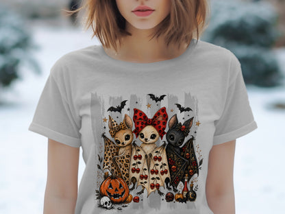 Three cartoon bats with Halloween decorations and a jack-o'-lantern.