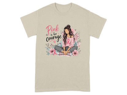 Pink is her courage graphic on a tan t-shirt with a woman and flowers.