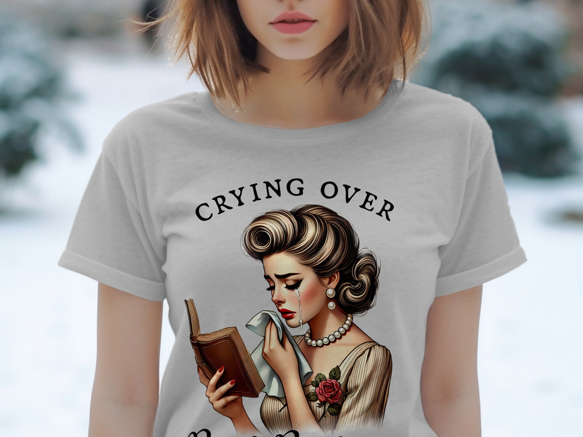 Gray t-shirt with "Crying Over" text and illustration of a crying woman holding a book.