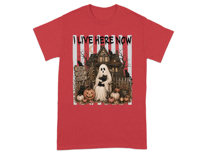 Ghost holding black cat with haunted house, pumpkins, and text "I LIVE HERE NOW".