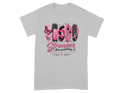 Grey t-shirt with "Stronger than yesterday" graphic and breast cancer awareness symbols.