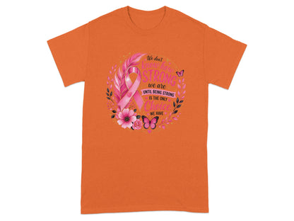 Orange t-shirt with pink ribbon design and inspirational quote.