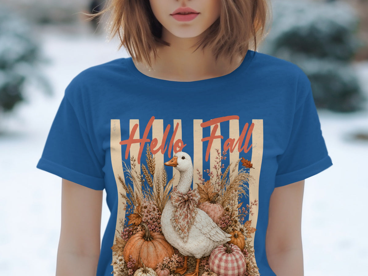 Blue t-shirt with "Hello Fall" text, a goose, pumpkins, and fall foliage.