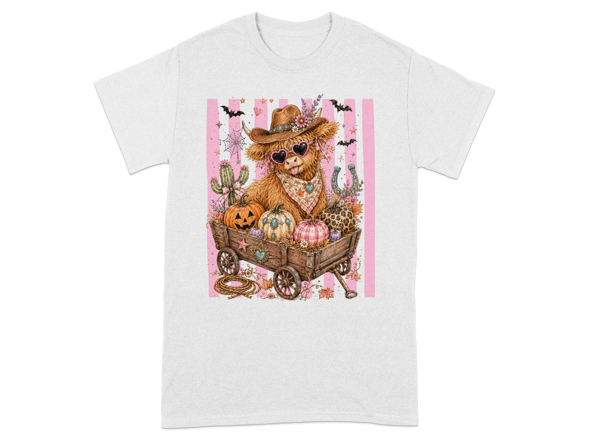 Cow print Highland cow wearing sunglasses and a cowboy hat in a wagon with pumpkins.