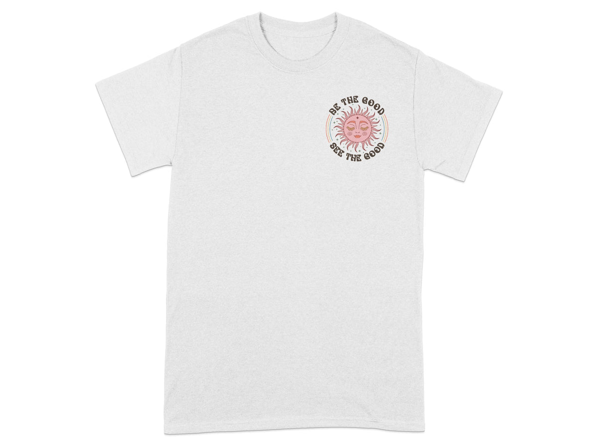 White t-shirt with pink sun graphic and text "Be the good see the good."