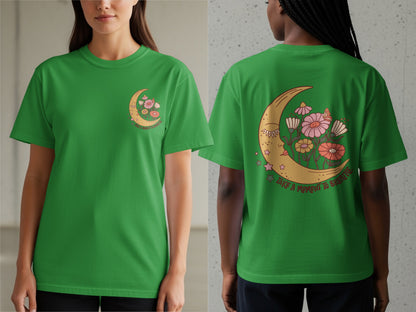 Green t-shirt with crescent moon, flowers, and text "TAKE A MOMENT TO BREATHE."