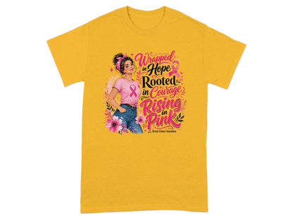 Yellow t-shirt with woman and text: Wrapped in Hope, Rooted in Courage, Rising in Pink.