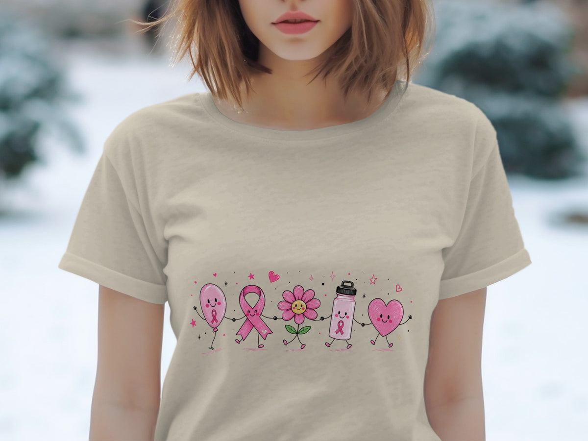 Pink balloon, ribbon, flower, water bottle, and heart graphic on a light beige t-shirt.