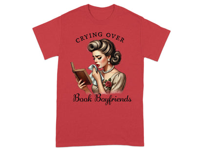 Red t-shirt with "Crying Over Book Boyfriends" text and retro illustration.