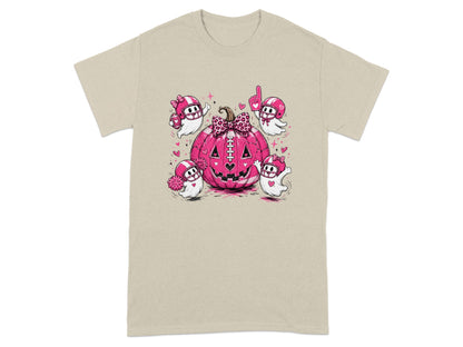 Pink pumpkin with football player ghosts wearing helmets on a tan t-shirt.
