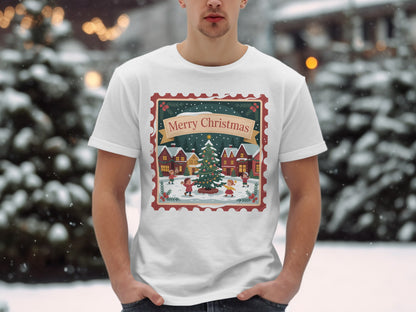 White t-shirt with a Christmas village scene inside a postage stamp border.